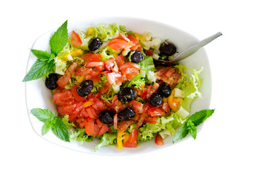 Isolated fresh plain salad garnished with mint