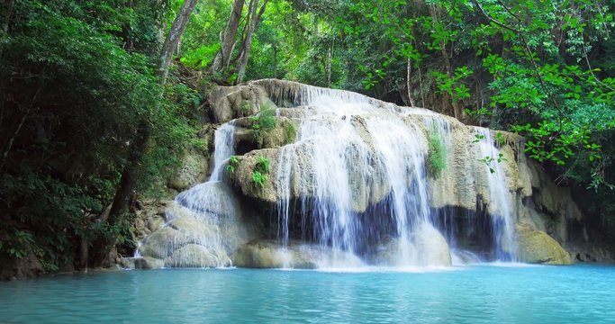 Exotic landscape with idyllic waterfall in tropical rainforest of Thailand