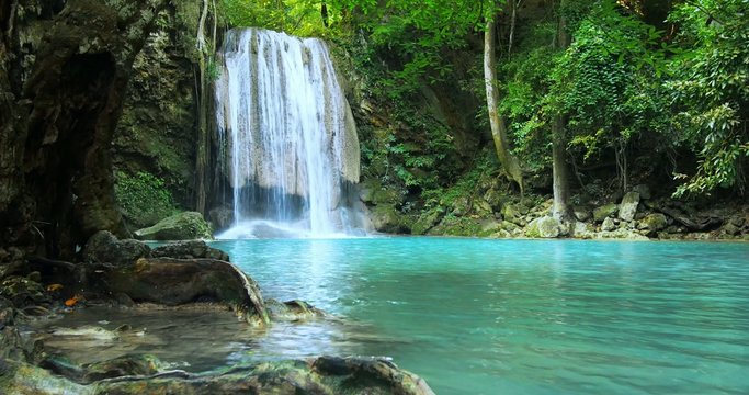 Amazing nature of evergreen rainforest. Beautiful waterfall falls to clean pond