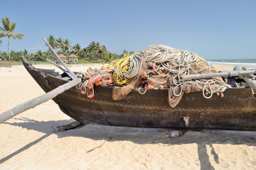 Traditional indian fishing boat at the beach of Kerala, India