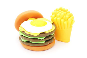 plastic toy hamburger with egg on top  and french fried on white background