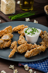 Chicken strips in popcorn breadcrumbs