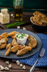 Chicken strips in popcorn breadcrumbs