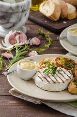 Grilled camembert with mini herbs baguettes