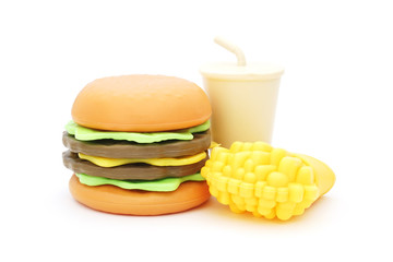 plastic toy hamburger with cool drink  and french fried on white background