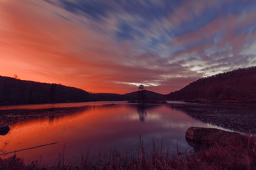 Fototapeta premium Sunset on the forest lake.