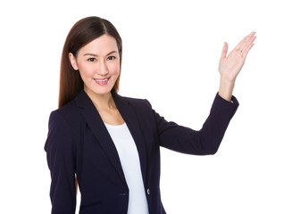 Young businesswoman with hand showing something
