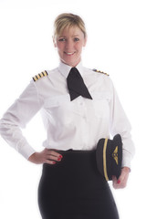 Attractive female airline pilot standing in uniform