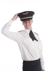 Attractive female airline pilot standing in uniform
