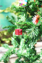 small  red gift box on christmas tree