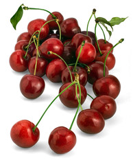 Heap of ripe Sweet Cherries (Prunus avium), isolated on white background.