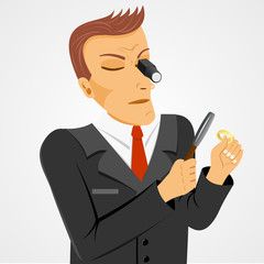 serious jeweler man with gold ring 