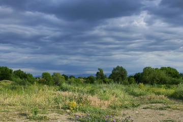 Summer landscape with storm clouds 