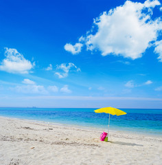 umbrella and bag on a tropical beach