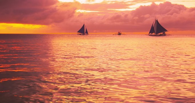 Beautiful colors of tropical sunset on sea coast near Boracay island