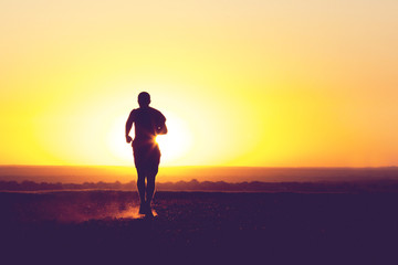 a young man running in the field
