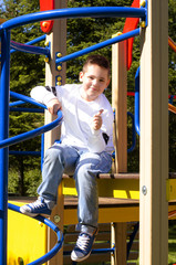 Obraz premium happy boy on the playground