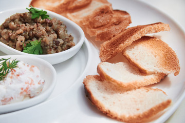 Toasts and salad on the plate
