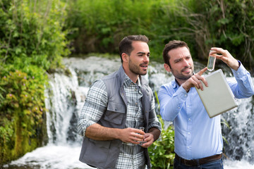 Scientist and biologist working together on water analysis
