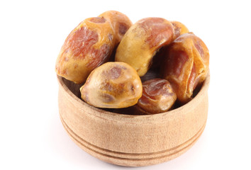 Dates with stones in a wooden round shape