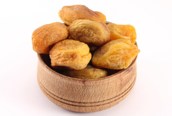 Dried apricot with a bone in the form of round wood