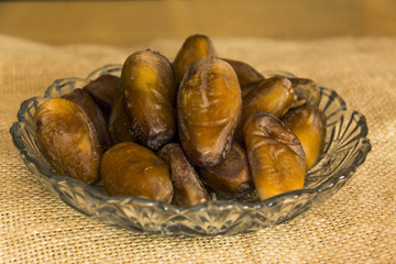 Dates fruit closeup on wooden background