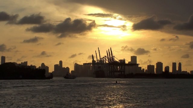 Skyline of Miami city with the Cargo Port from Miami Beach at sunset. 
