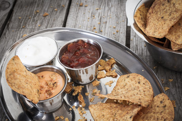 nachos with tomato salsa and sour cream