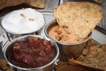 nachos with tomato salsa and sour cream