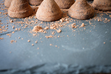 Fototapeta na wymiar Chocolate truffles with cocoa sweet temptation