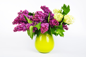 Lilac flowers in a green vase