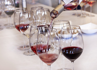 Wine tasting: rose wine being poured into a glass