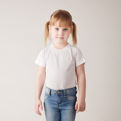 Fototapeta premium Cute little girl in white tee-shirt
