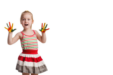 Fototapeta na wymiar Funny little girl with hands painted in colorful paint. Isolated