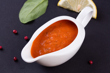 fresh tomato sauce in the white sauce boat
