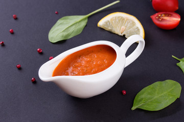 fresh tomato sauce in the white sauce boat