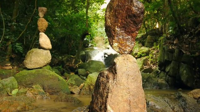 Zen meditation and relaxation nature background of rock towers in tropical garde