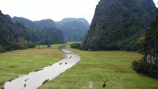 Rice fields, mountains and river in Tam Coc, Ninh Binh, Vietnam 