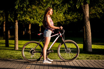Girl sitting on bicycle