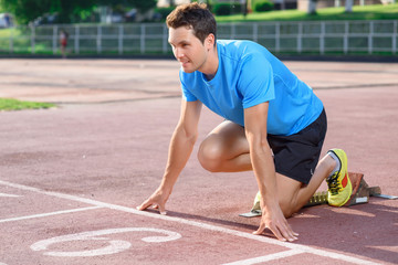 Fototapeta premium Young sportsman going to run 