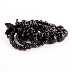 Beautiful black bracelets on white background