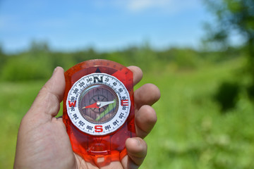 Compass in hand.