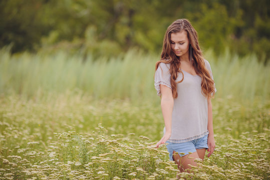 Candid skipping carefree adorable woman in field 
