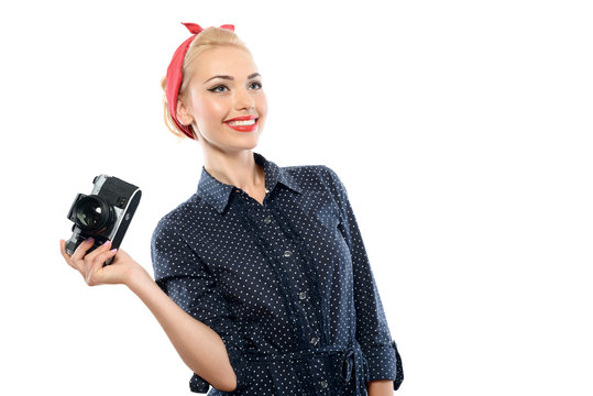 Pin up girl with a camera