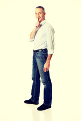 Man with silent gesture