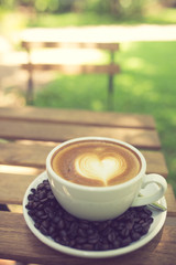 Latte Art coffee with coffee bean vintage color