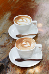  Cup of latte coffee on wooden table