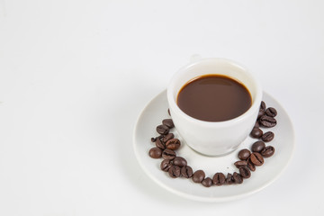 Coffee cup and beans on a white background.
