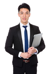 Asian businessman hold with notebook computer