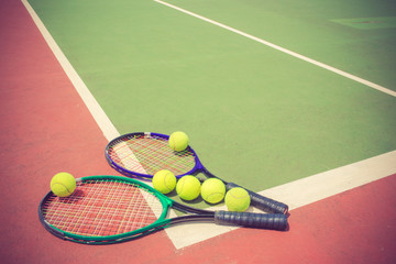 tennis racket and balls on the tennis court vintage color